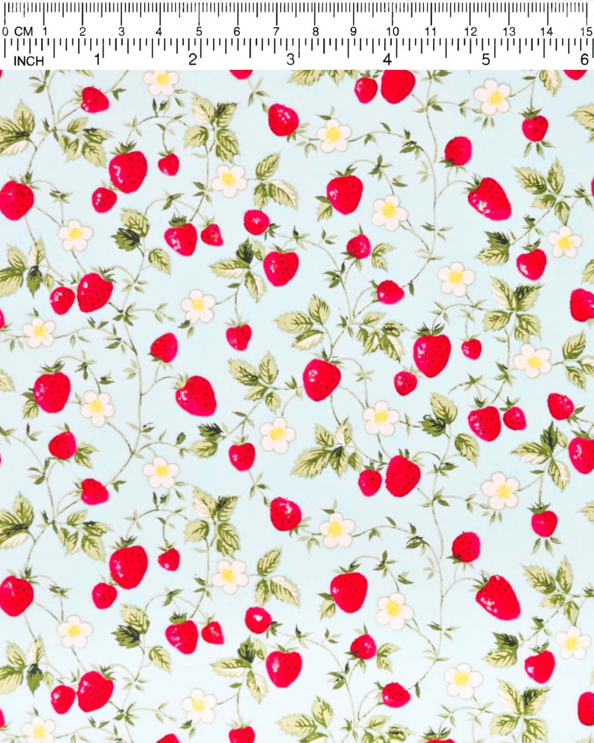 Japanese chiyogami paper featuring red strawberries with green leaves and white flowers with yellow centers on a light blue background. 