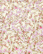 Japanese chiyogami paper featuring light pink and white plum blossoms with dark brown branches and green leaves on a gold background with metallic gold details.