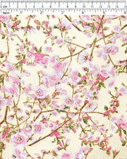 Japanese chiyogami paper featuring light pink and white plum blossoms with dark brown branches and green leaves on a gold background with metallic gold details.