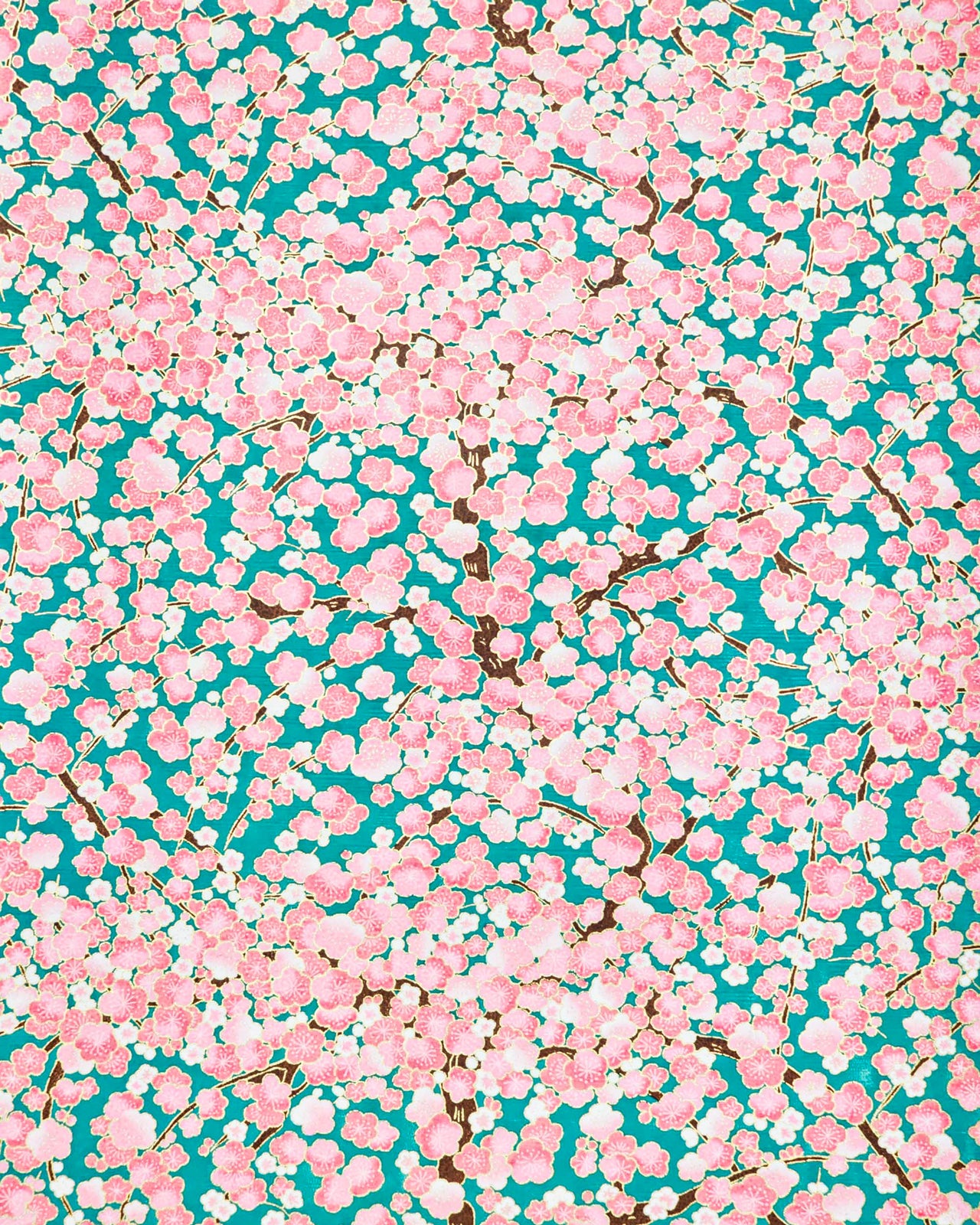 Japanese chiyogami paper featuring pink and white plum blossom trees with brown branches on a teal green background with metallic gold details.