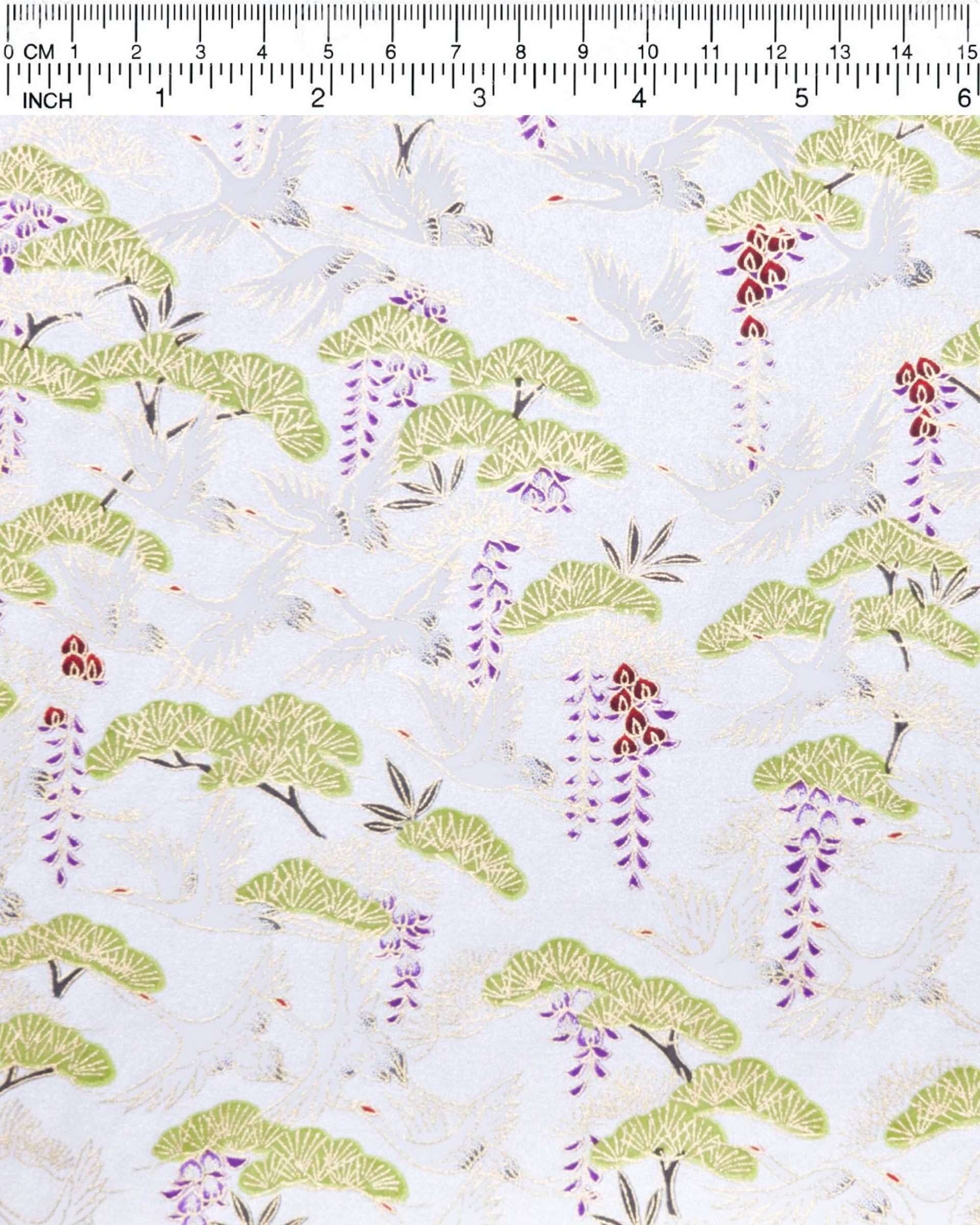Japanese chiyogami paper featuring white flying cranes, purple and red wisteria, and green pine on a pearlescent white background with metallic gold details.