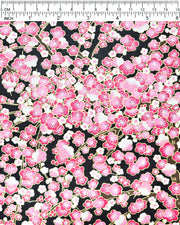Japanese chiyogami paper featuring pink and white plum blossom trees with brown branches on a black background with metallic gold details.