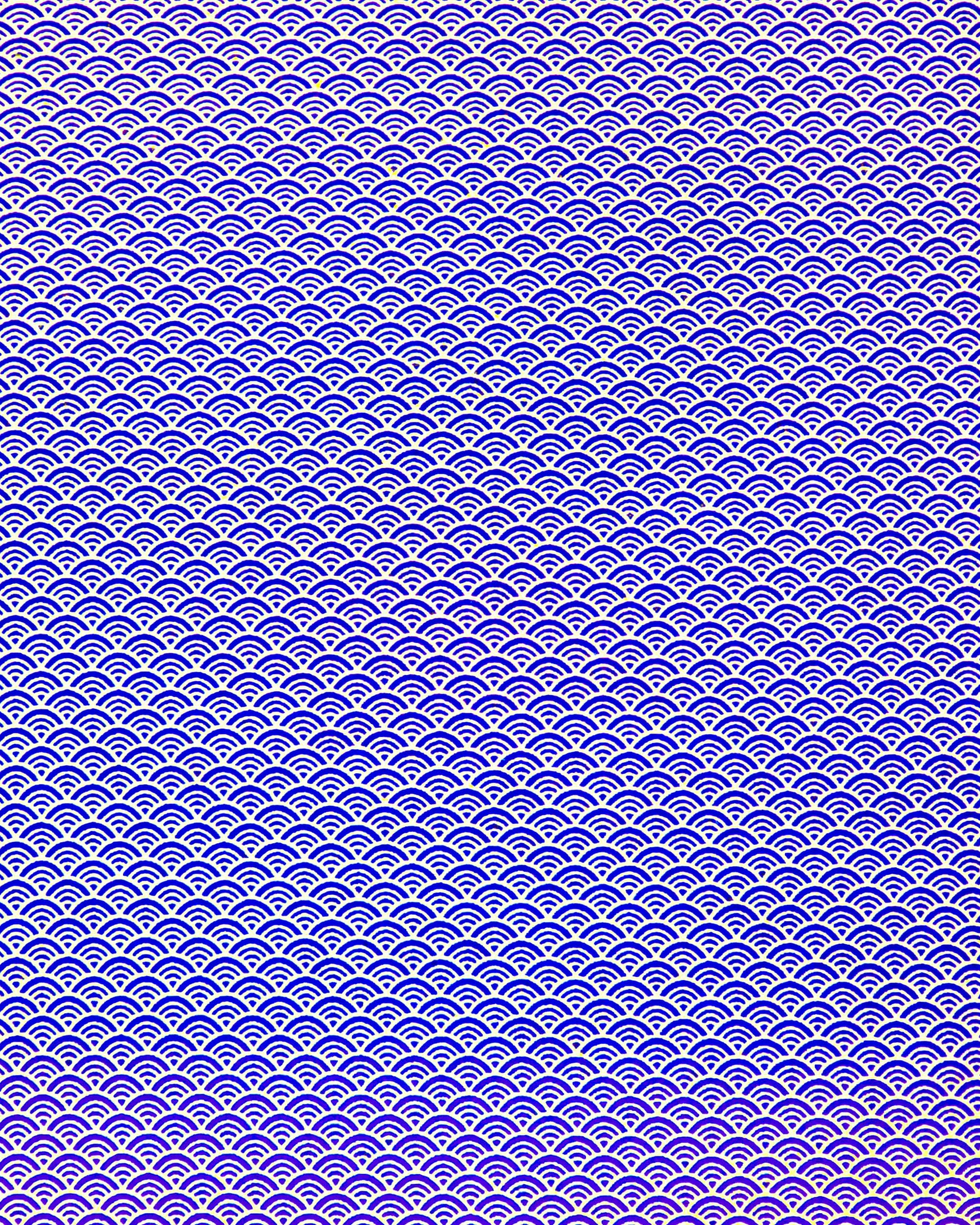 Japanese chiyogami paper featuring a small traditional blue and metallic gold seigaiha (wave crests) pattern.