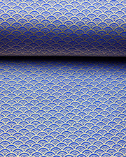 Japanese chiyogami paper featuring a small traditional blue and metallic gold seigaiha (wave crests) pattern.