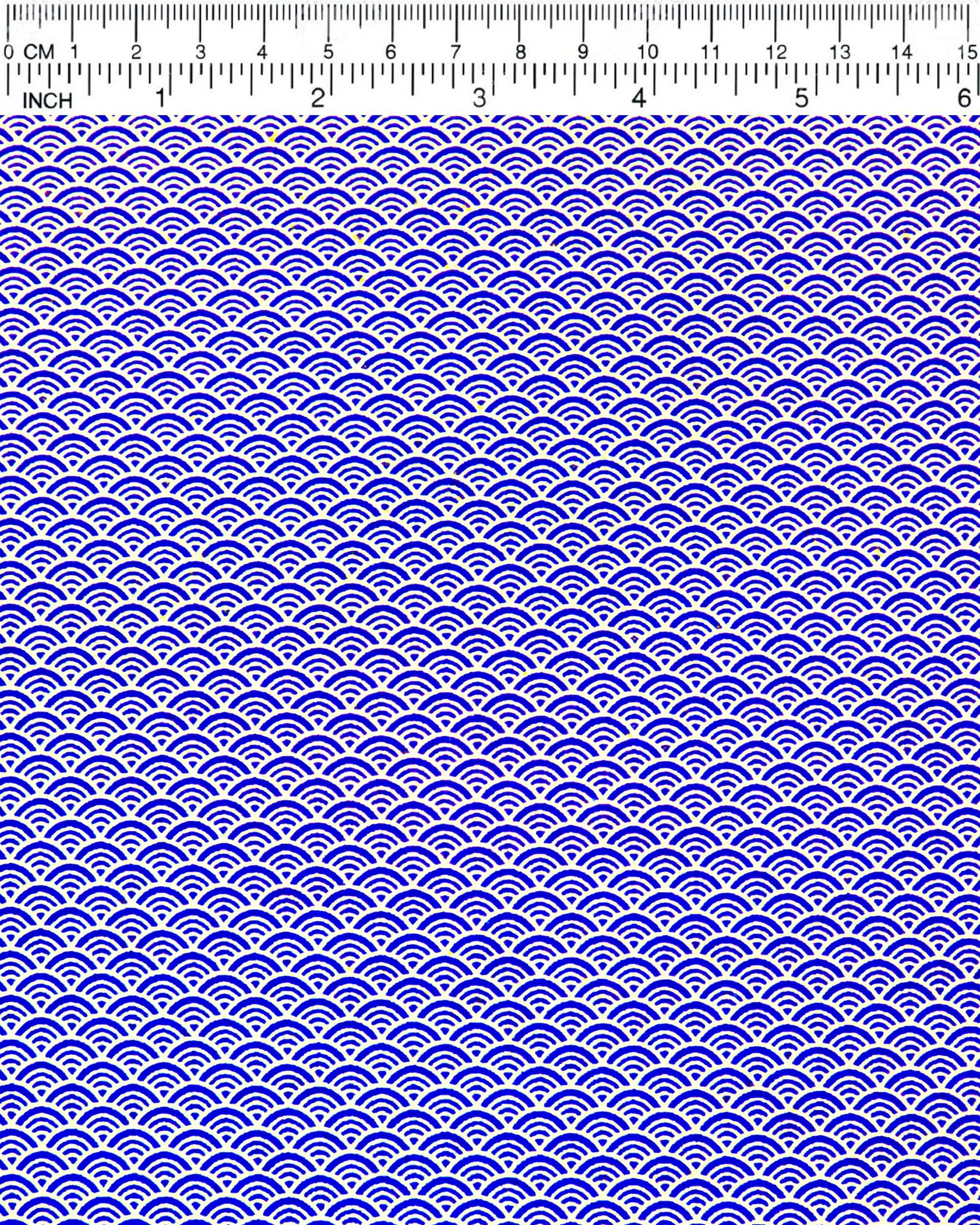 Japanese chiyogami paper featuring a small traditional blue and metallic gold seigaiha (wave crests) pattern.