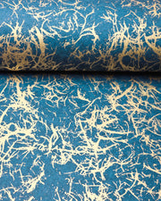 Japanese chiyogami paper featuring a metallic gold fiber-like unryu design on a blue background.