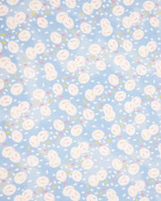 Japanese chiyogami paper featuring round white rabbits with pink and yellow ears surrounded by white, pink, and yellow flower petals on light blue background.