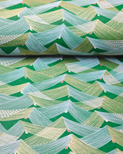 Japanese chiyogami paper featuring thin metallic gold and white lines in a triangular shape with small red and white triangles on a dark green background.