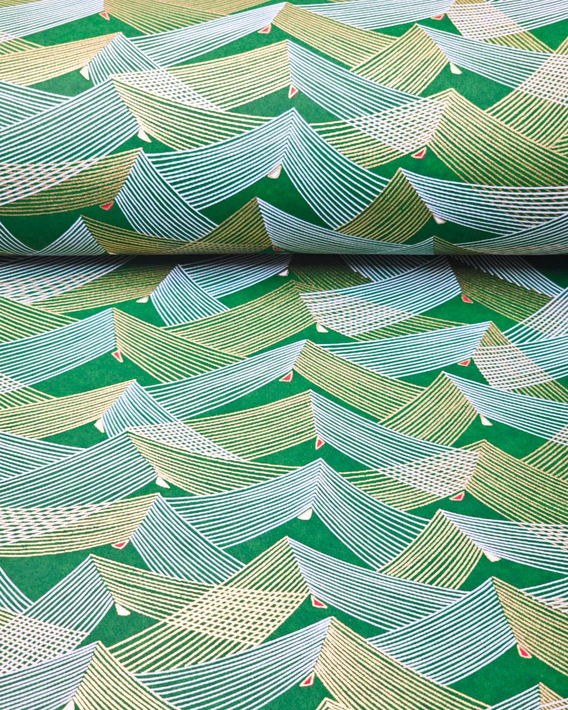 Japanese chiyogami paper featuring thin metallic gold and white lines in a triangular shape with small red and white triangles on a dark green background.