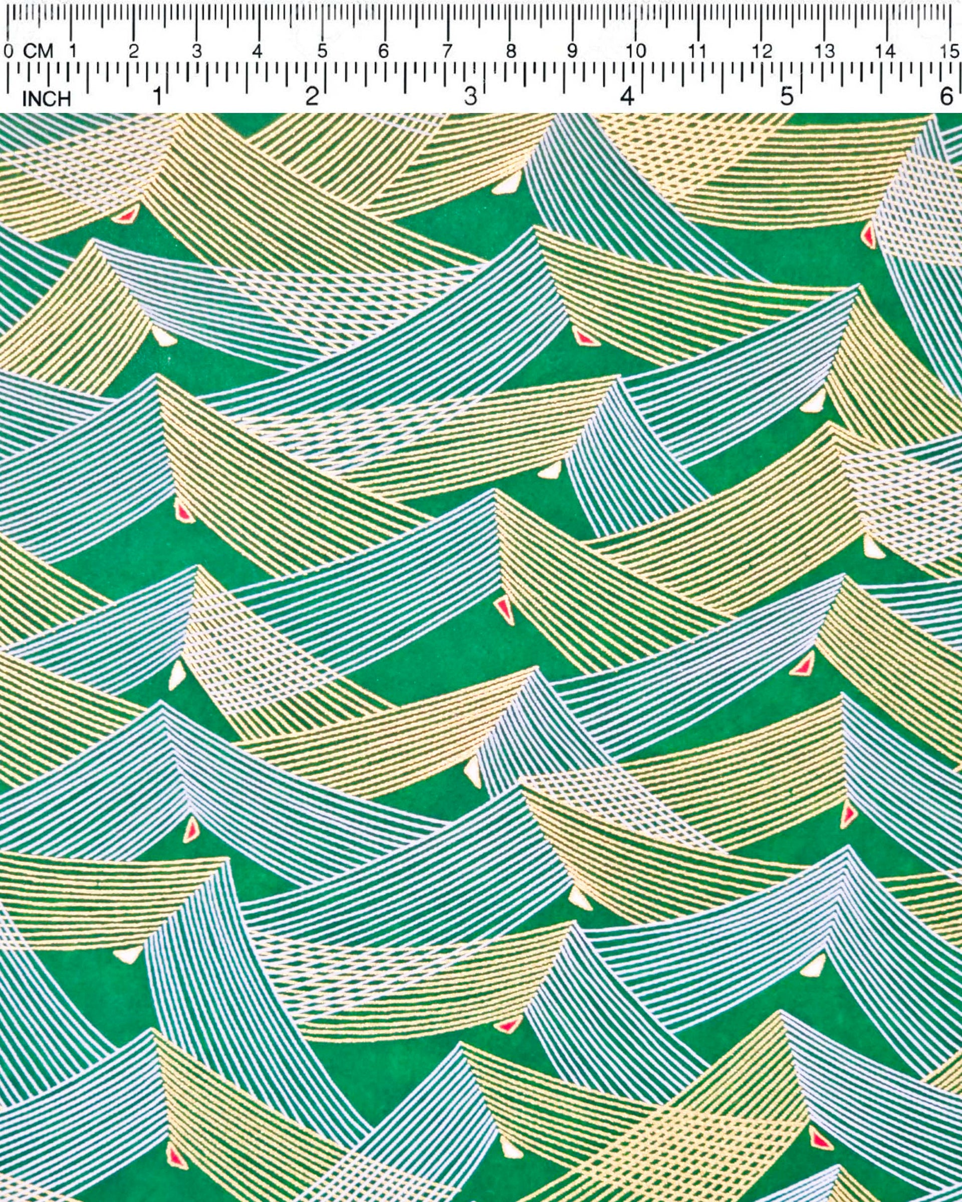 Japanese chiyogami paper featuring thin metallic gold and white lines in a triangular shape with small red and white triangles on a dark green background.