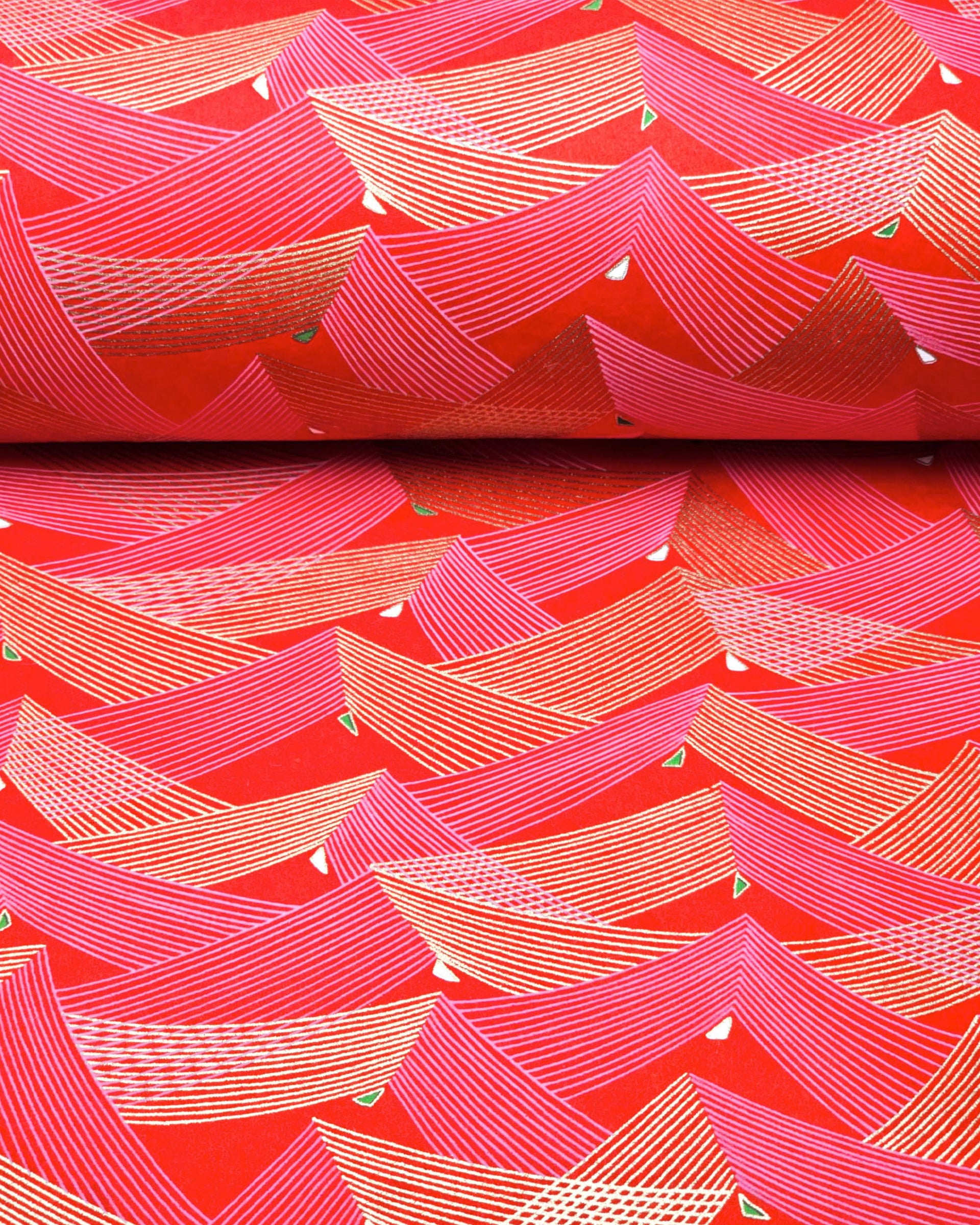 Japanese chiyogami paper featuring thin metallic gold and white lines in a triangular shape with small green and white triangles on a red background.