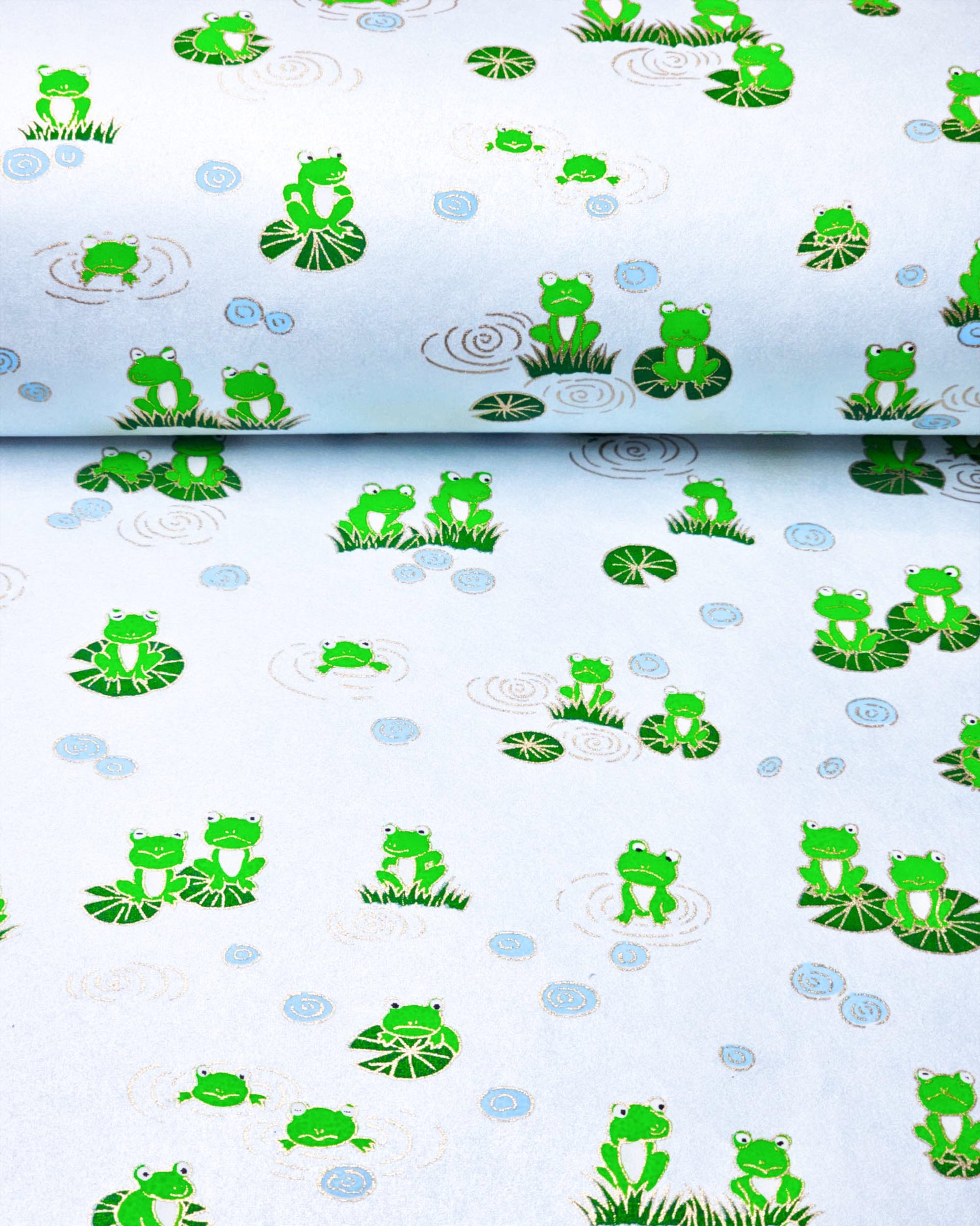 Japanese chiyogami paper featuring green frogs on green lily pads on a pearlescent light blue background with metallic gold details.