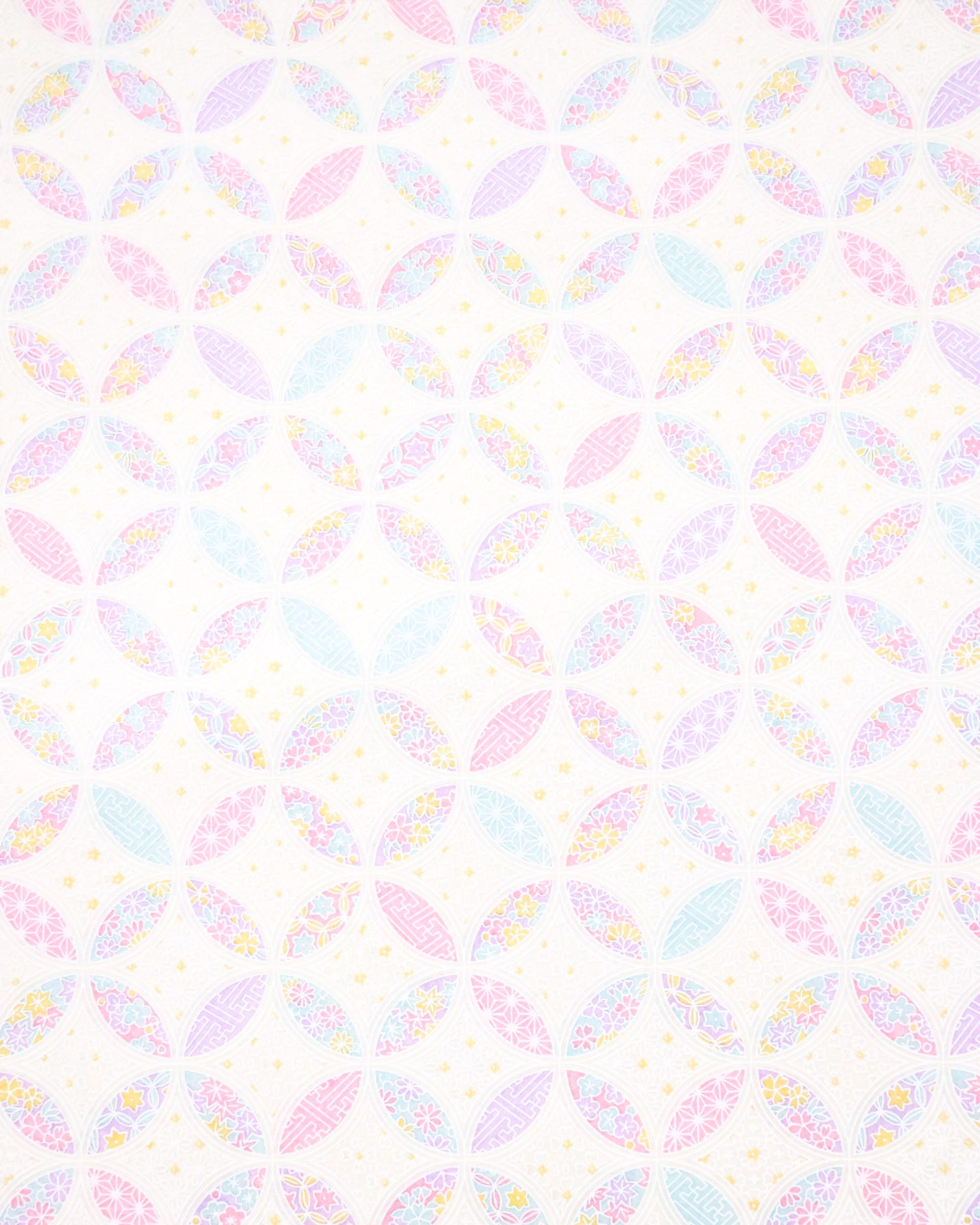 Japanese chiyogami paper featuring a light pastel-colored shippo design filled with floral and geometric designs in shades of pink, purple, blue, and yellow on a white background.