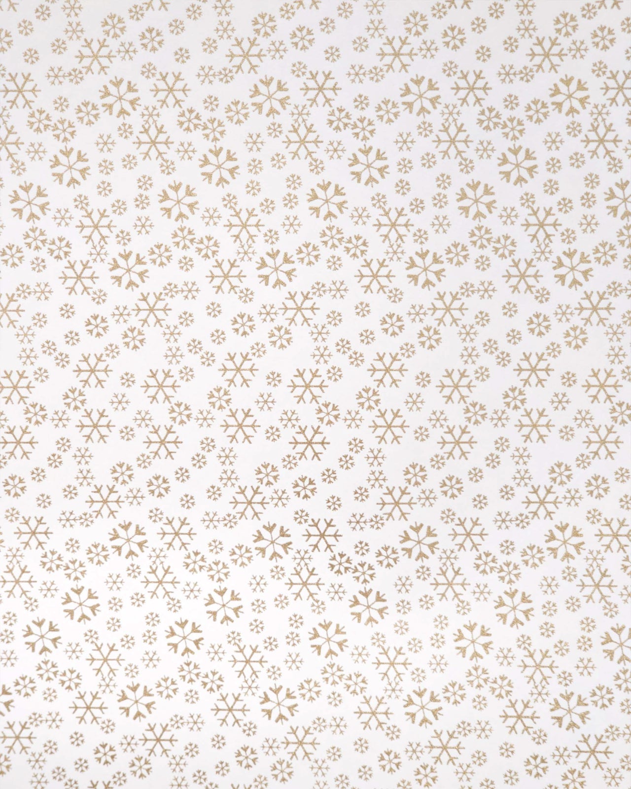 Japanese chiyogami paper featuring metallic gold snowflakes of various sizes on a white background.
