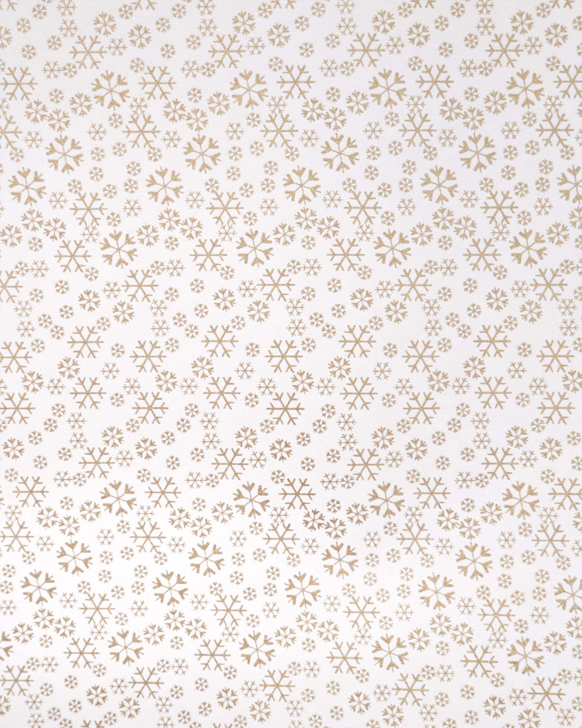 Japanese chiyogami paper featuring metallic gold snowflakes of various sizes on a white background.