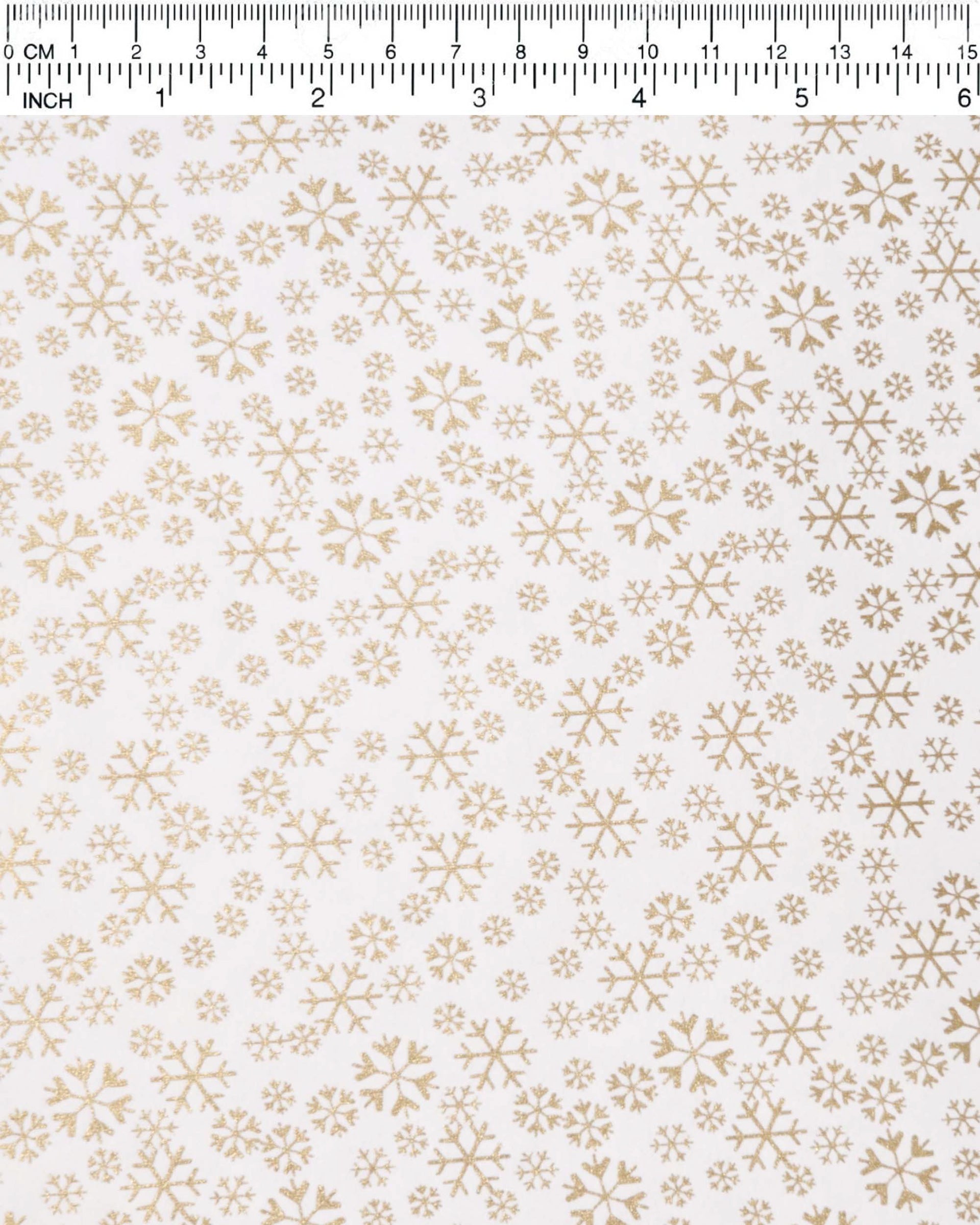 Japanese chiyogami paper featuring metallic gold snowflakes of various sizes on a white background.