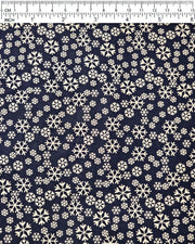 Japanese chiyogami paper featuring metallic gold snowflakes of various sizes on a black background.