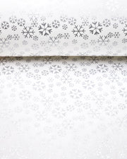 Japanese chiyogami paper featuring metallic silver snowflakes of various sizes on a white background.