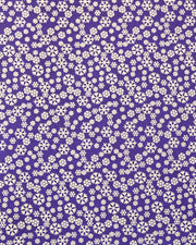 Japanese chiyogami paper featuring metallic gold snowflakes of various sizes on a dark blue background.