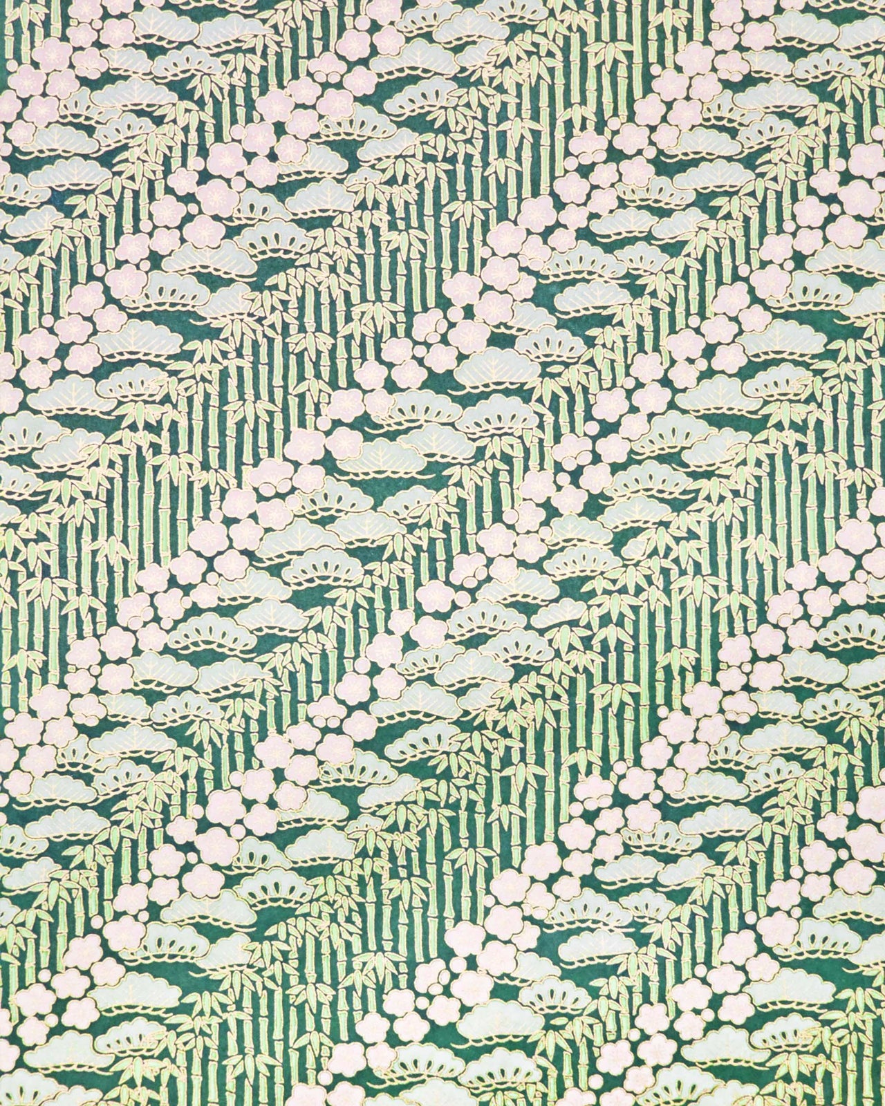 Japanese chiyogami paper featuring cream plum blossoms, light green pine, and green bamboo on green background with metallic gold details.
