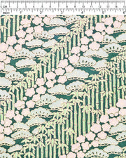 Japanese chiyogami paper featuring cream plum blossoms, light green pine, and green bamboo on green background with metallic gold details.
