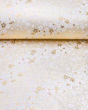 Japanese chiyogami paper featuring small white and metallic gold cherry blossoms on pearlescent cream background with metallic silver details.