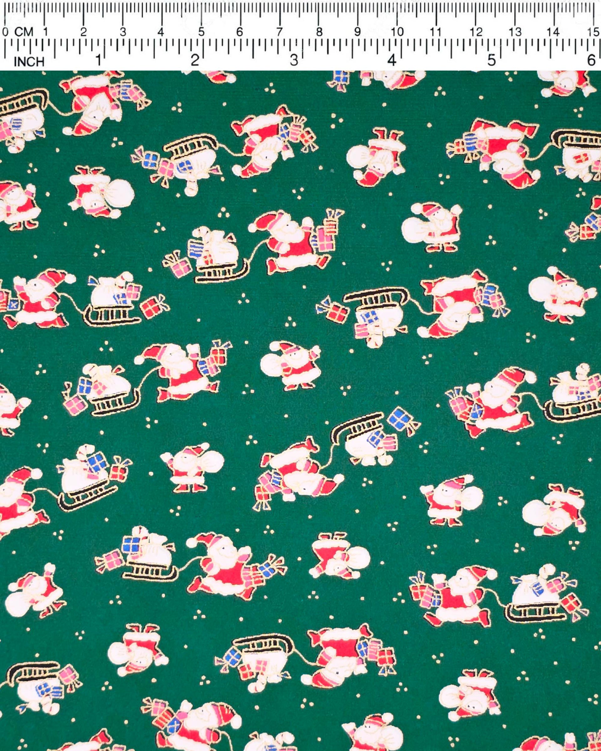 Japanese chiyogami paper featuring cartoon Santas in red outfits pulling sleds with presents and carrying sacks of presents on a green background with metallic gold details. 
