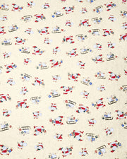 Japanese chiyogami paper featuring cartoon Santas in red outfits pulling sleds with presents and carrying sacks of presents on a metallic gold background with metallic gold details. 