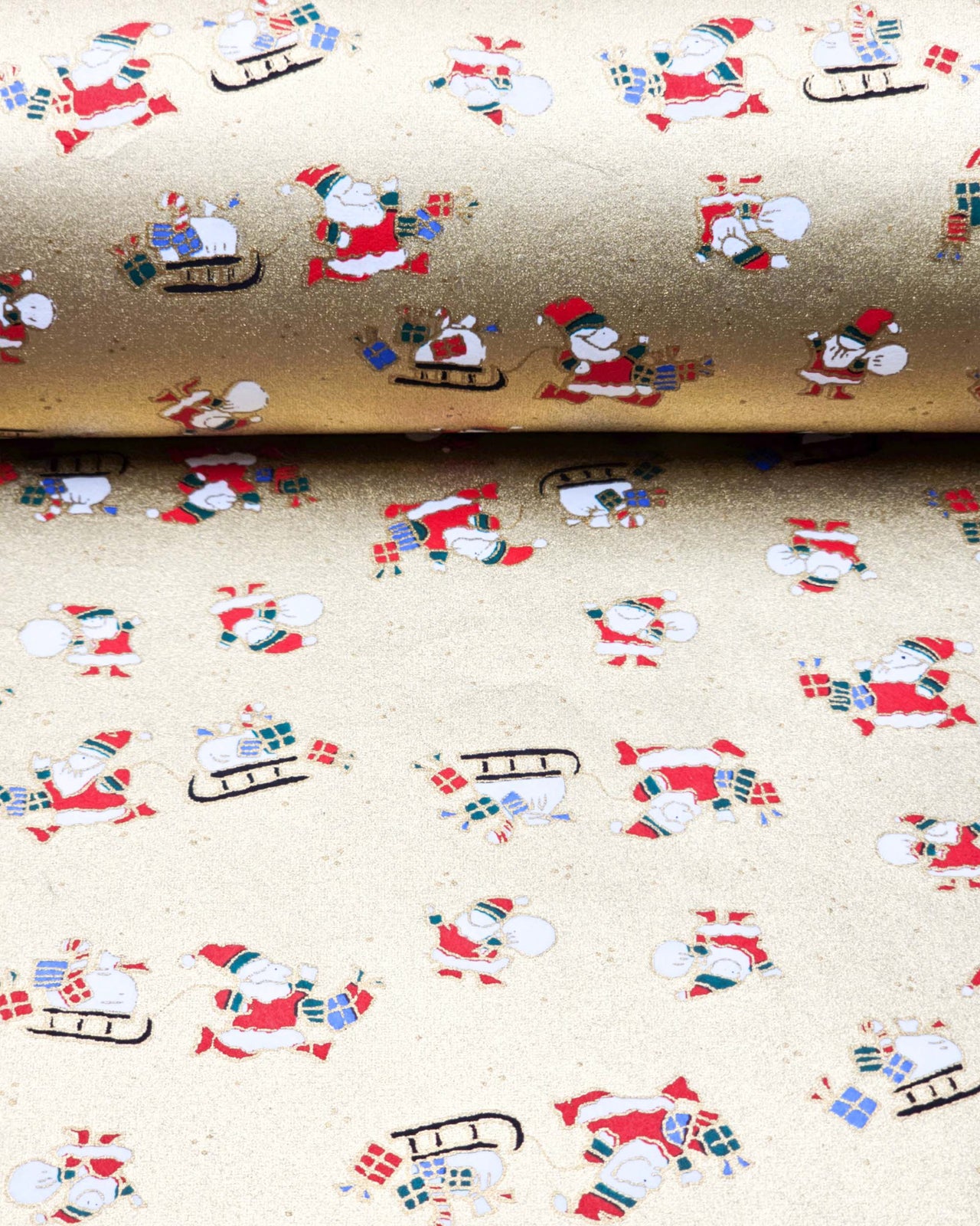 Japanese chiyogami paper featuring Santa and his sleigh on a metallic gold background.