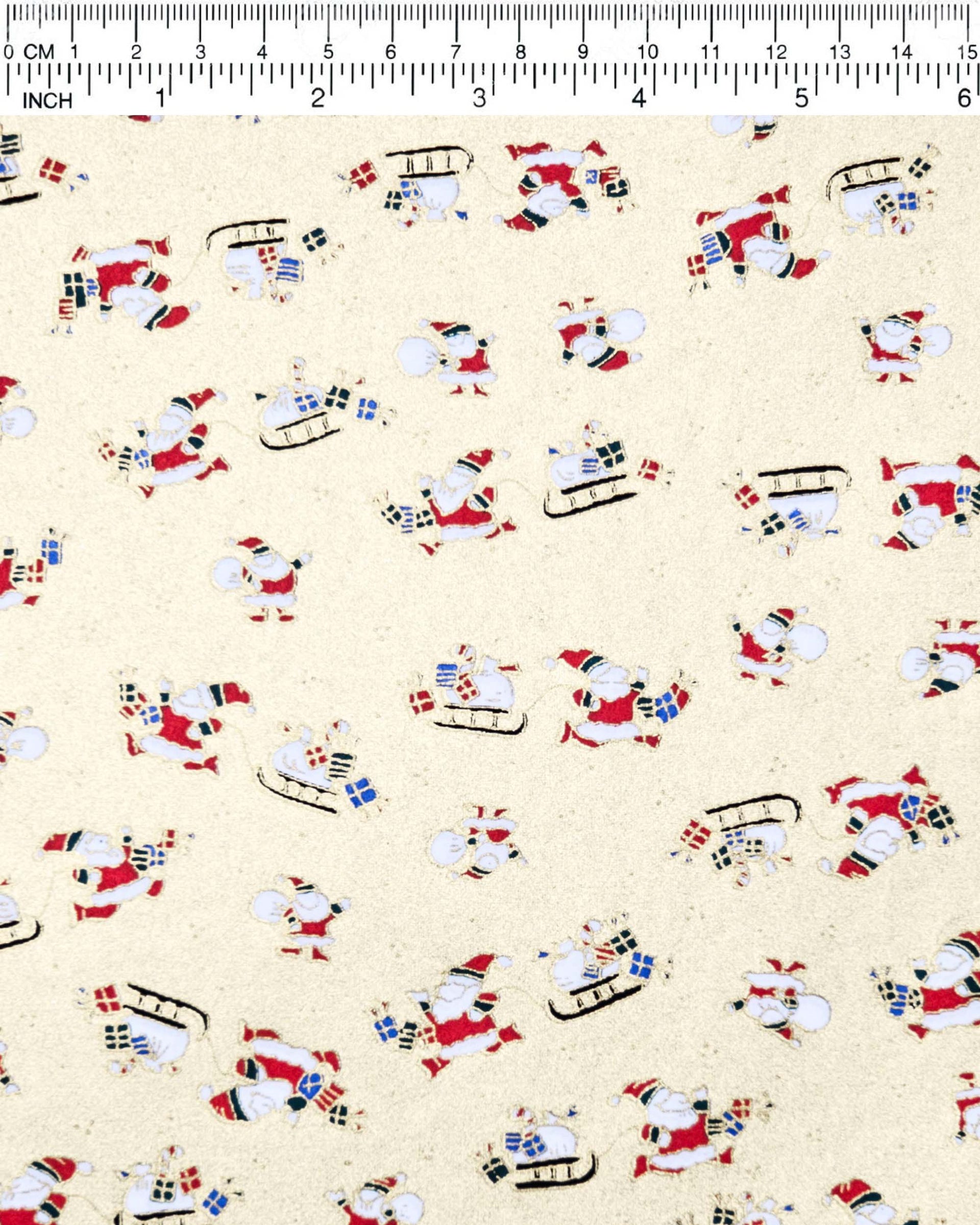 Japanese chiyogami paper featuring Santa and his sleigh on a metallic gold background.