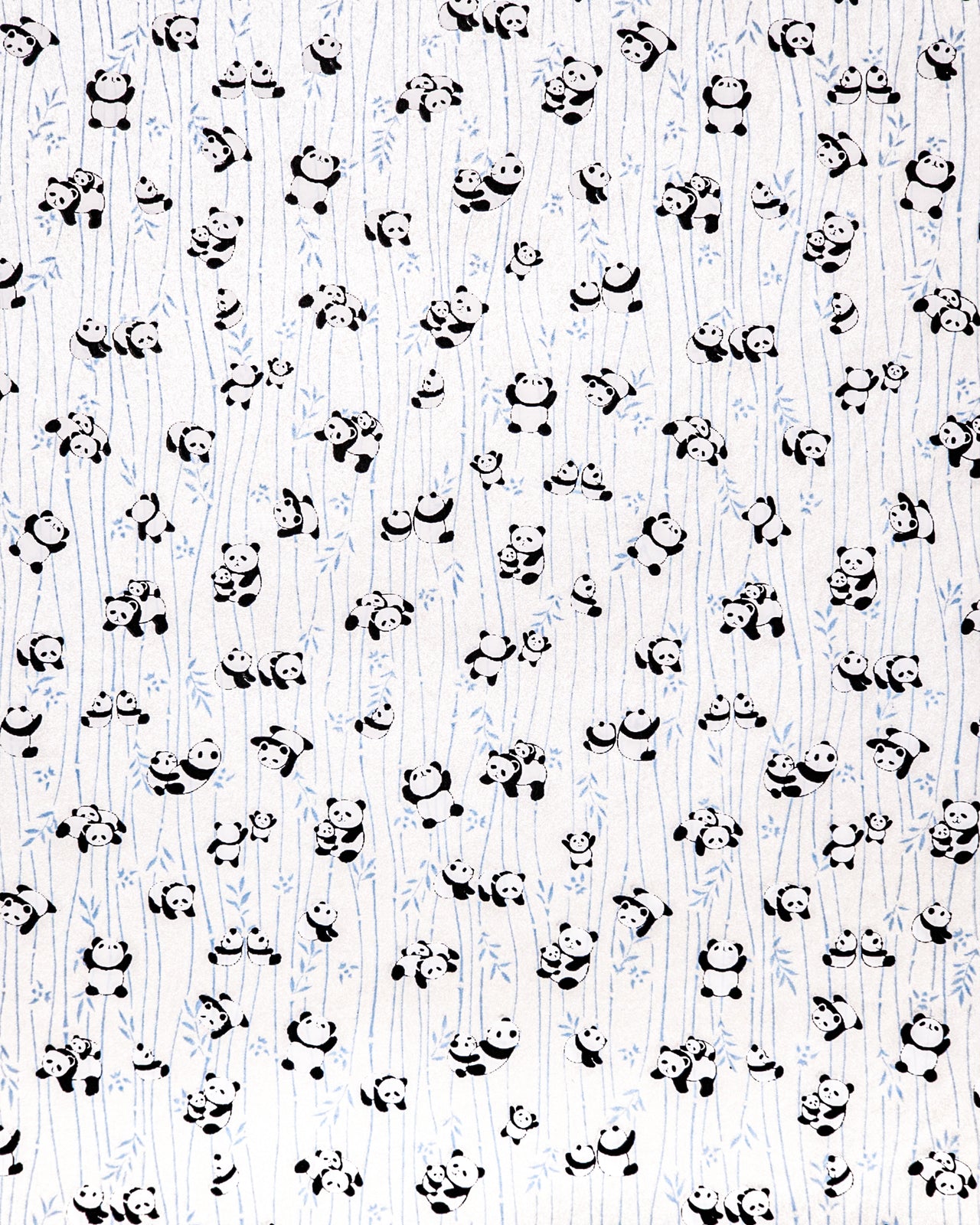Japanese chiyogami paper featuring black and white pandas with blue bamboo stalks on a pearlescent white background.