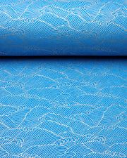 Japanese chiyogami paper featuring metallic gold waves (aranami) on a royal blue background.