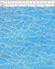 Japanese chiyogami paper featuring metallic gold waves (aranami) on a royal blue background.