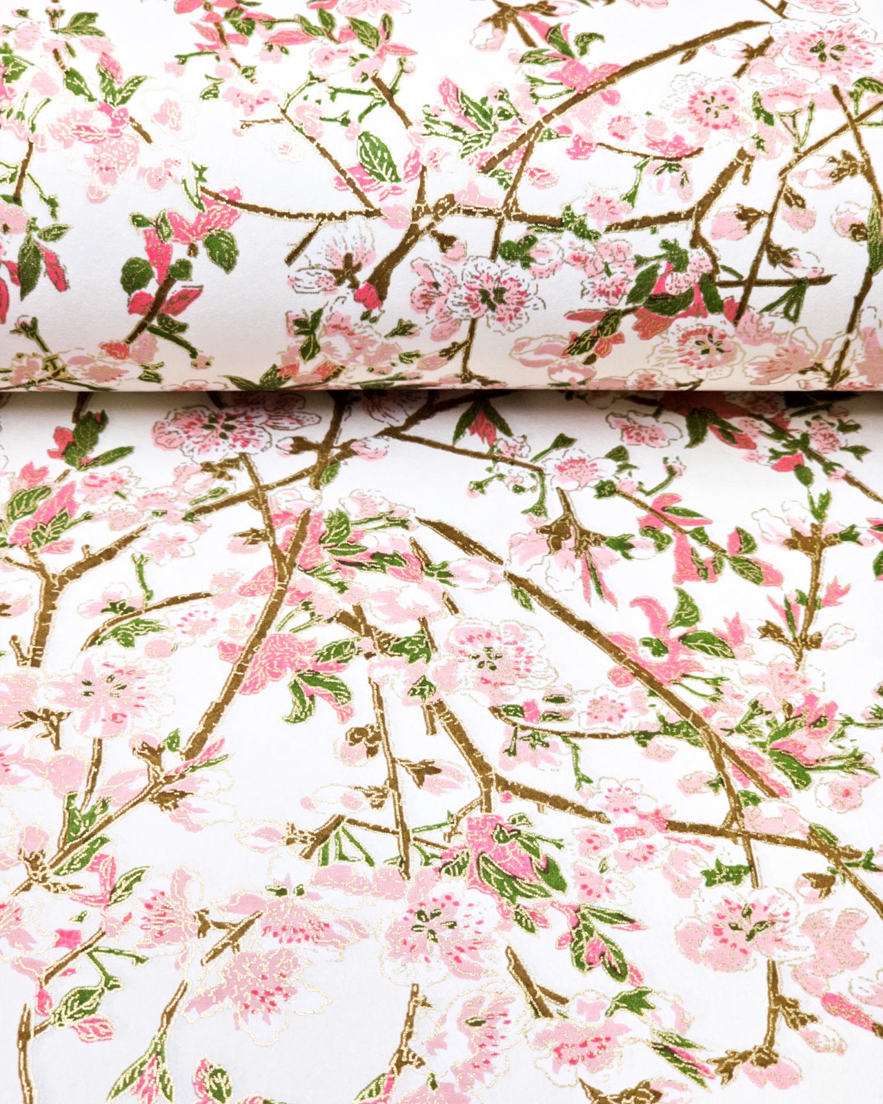 Japanese chiyogami paper featuring pink and white detailed plum blossoms with brown branches and green leaves on a white background with metallic gold details.