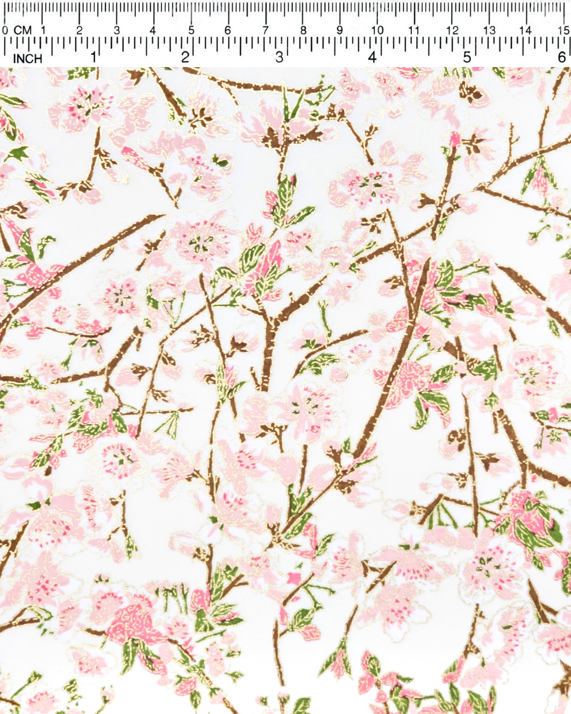 Japanese chiyogami paper featuring pink and white detailed plum blossoms with brown branches and green leaves on a white background with metallic gold details.
