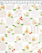 Japanese chiyogami paper featuring silver snakes and gold assorted traditional Japanese designs in an ichimatsu (checker) design on a white background with metallic gold details. Small red plum blossoms and green bamboo leaves are scattered throughout the design.