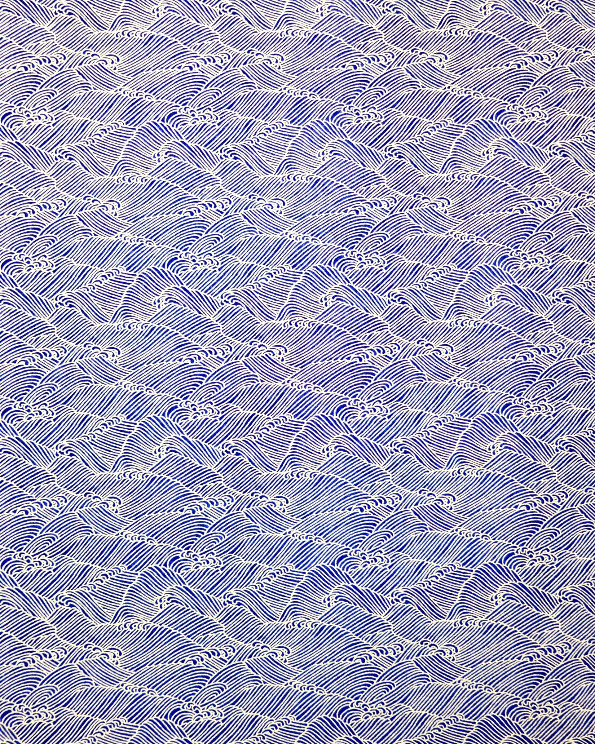 Japanese chiyogami paper featuring small metallic gold waves (aranami) on a dark blue background.