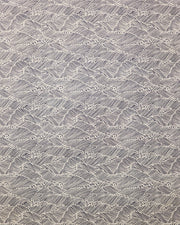 Japanese chiyogami paper featuring small metallic gold waves (aranami) on a black background.
