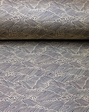 Japanese chiyogami paper featuring small metallic gold waves (aranami) on a black background.