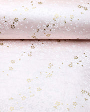 Japanese chiyogami paper featuring small white and metallic gold cherry blossoms on pearlescent pink background with metallic silver details.