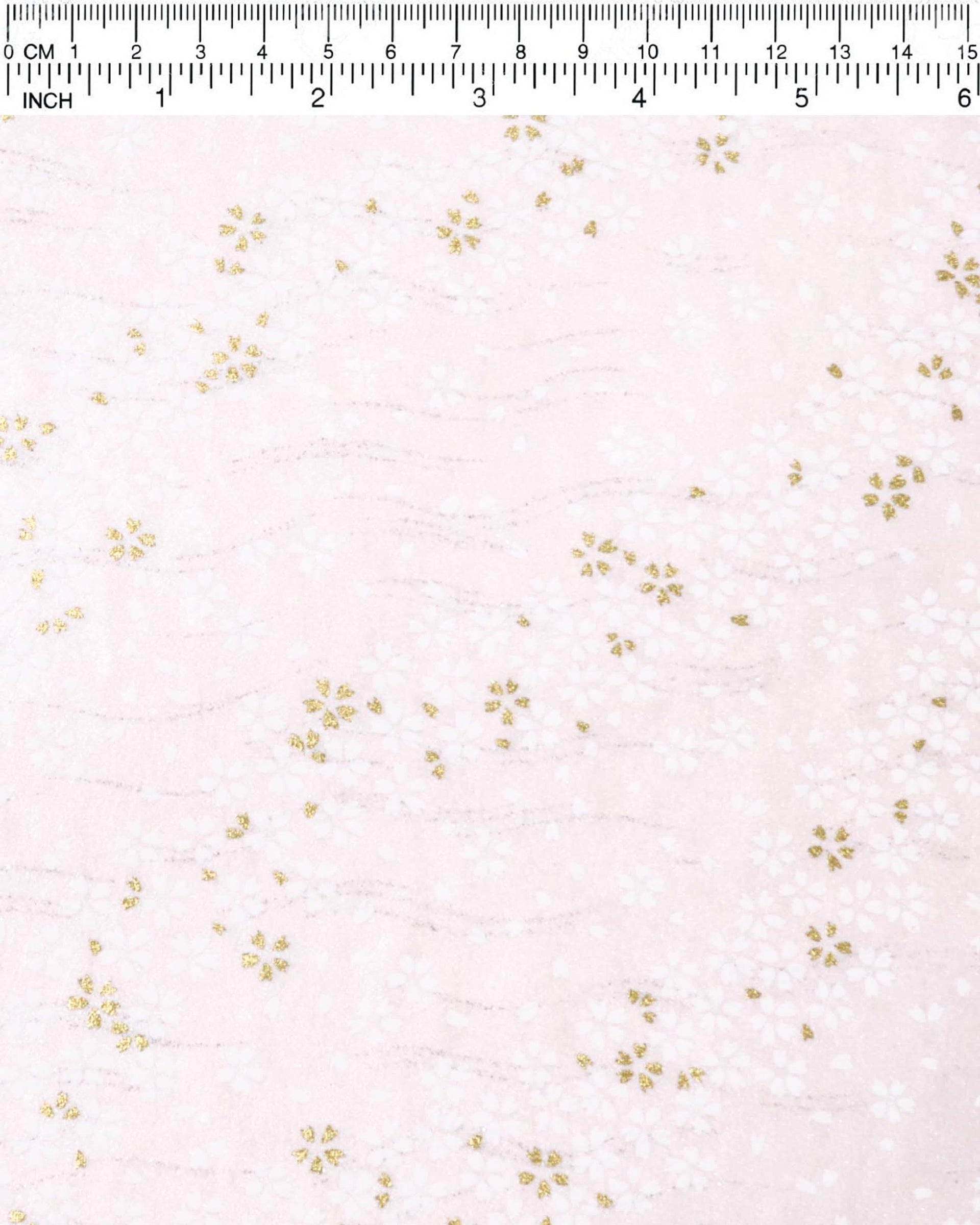 Japanese chiyogami paper featuring small white and metallic gold cherry blossoms on pearlescent pink background with metallic silver details.