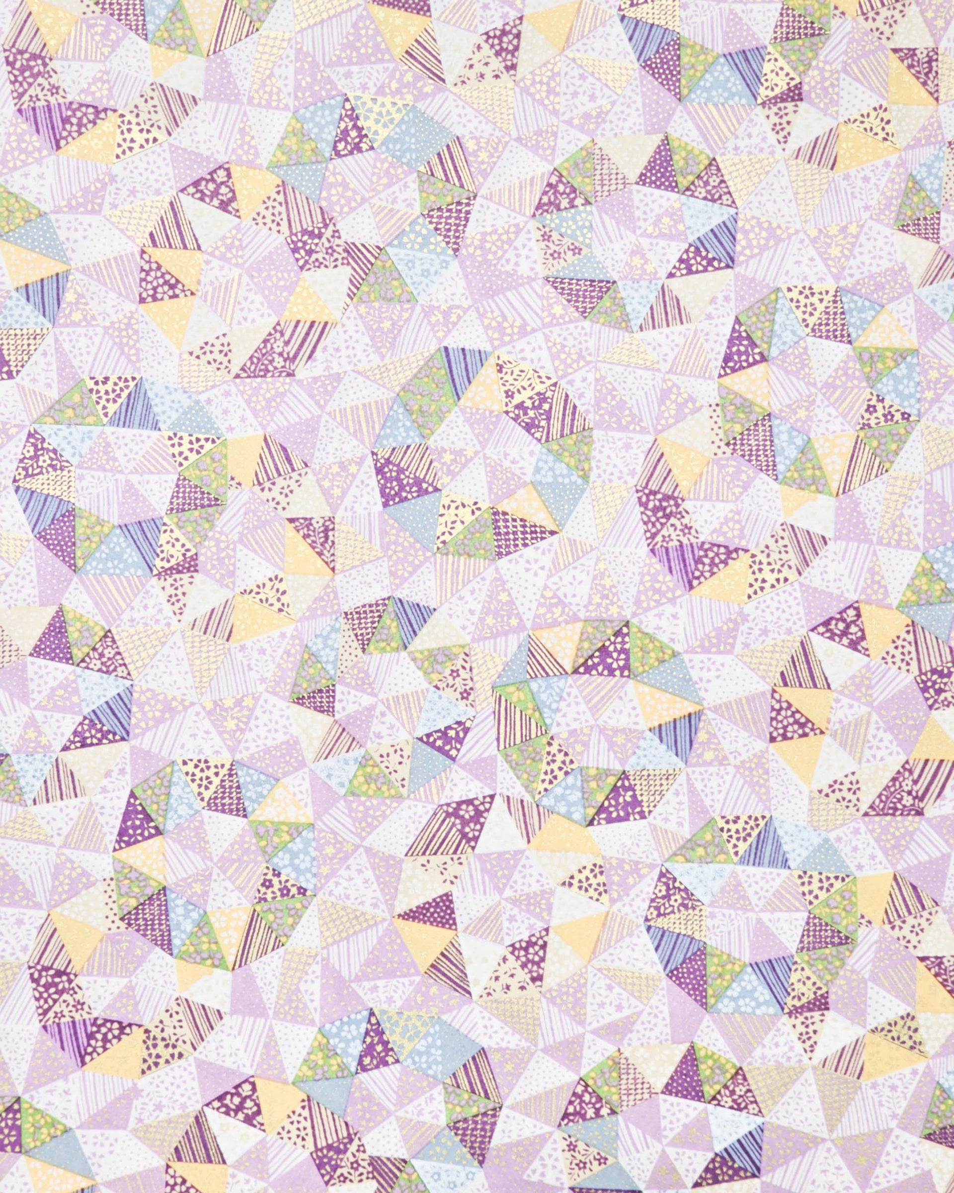 Japanese chiyogami paper featuring purple, yellow, green, and blue triangular patches decorated with assorted traditional Japanese motifs with metallic gold details.