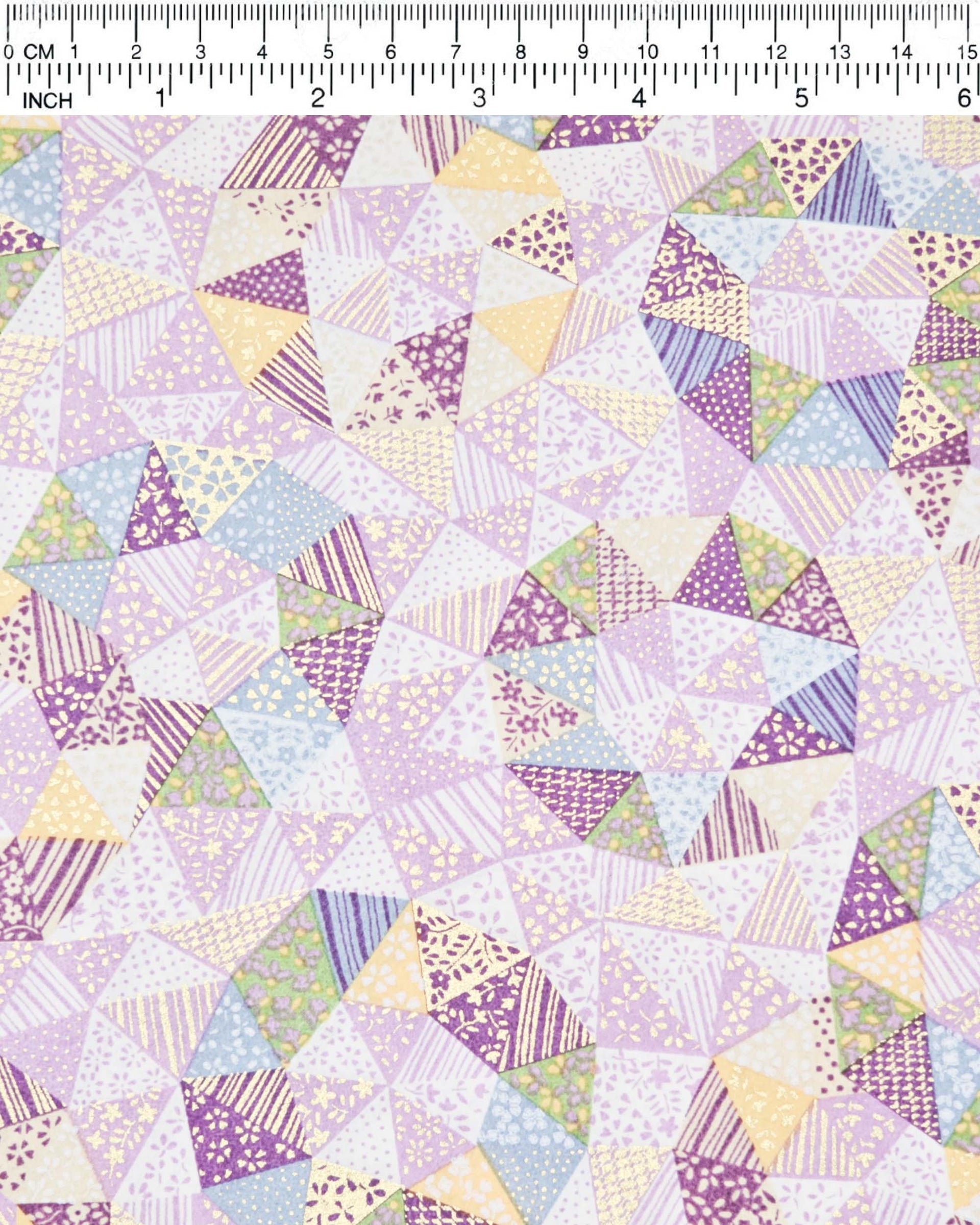 Japanese chiyogami paper featuring purple, yellow, green, and blue triangular patches decorated with assorted traditional Japanese motifs with metallic gold details.