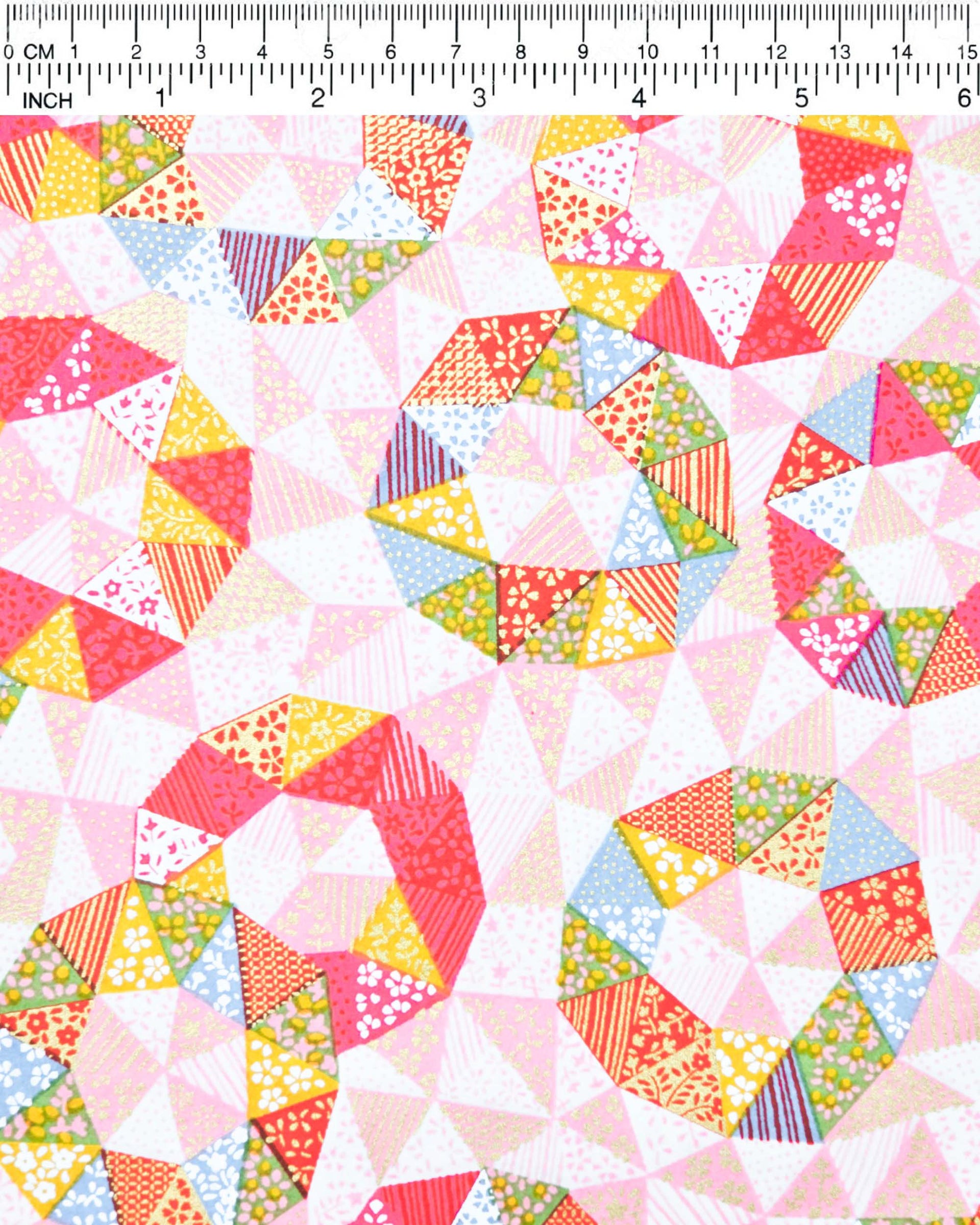 Japanese chiyogami paper featuring pink, yellow, green, and blue triangular patches decorated with assorted traditional Japanese motifs with metallic gold details.