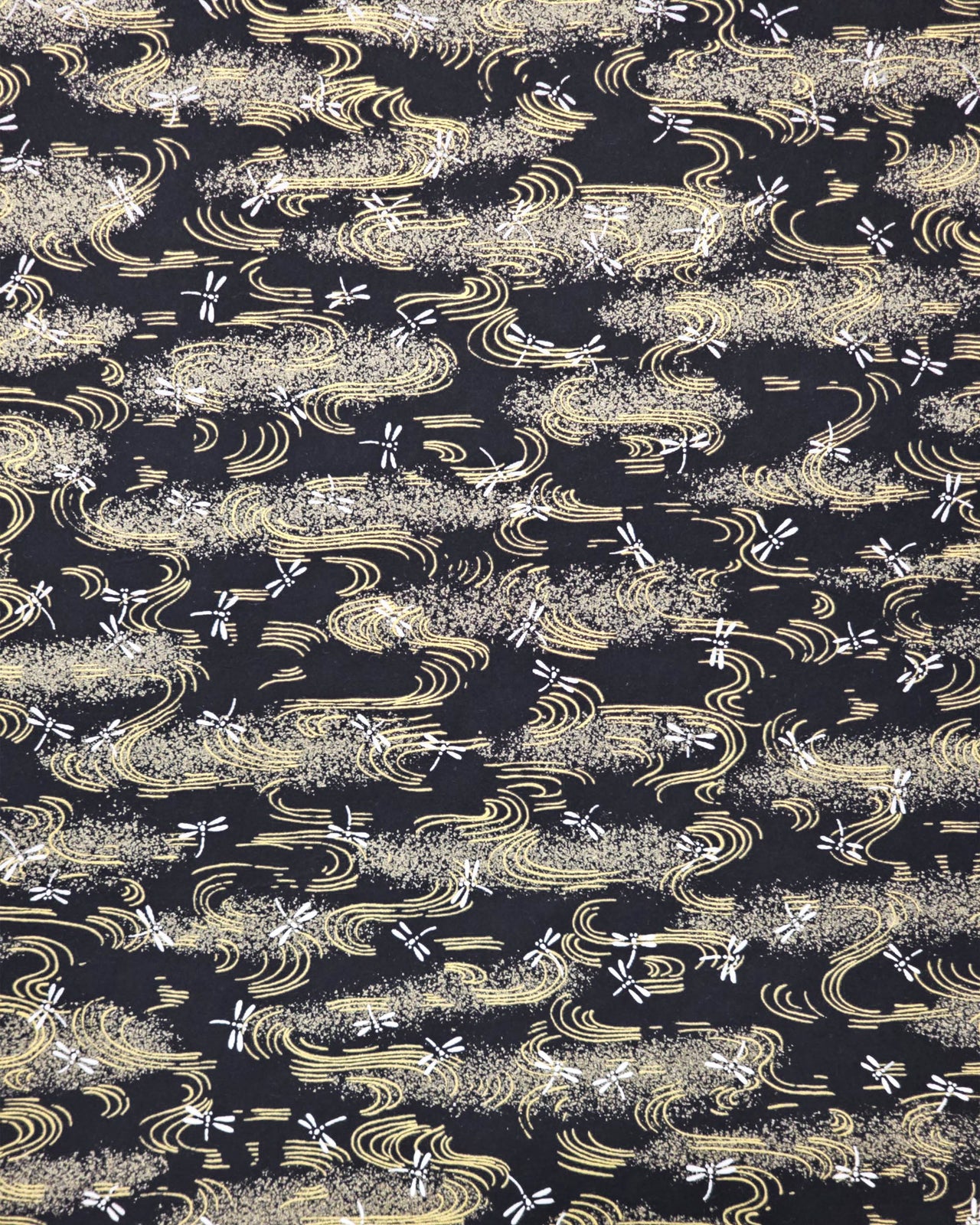 Japanese chiyogami paper featuring white dragonflies on a black background with metallic gold wavy lines.