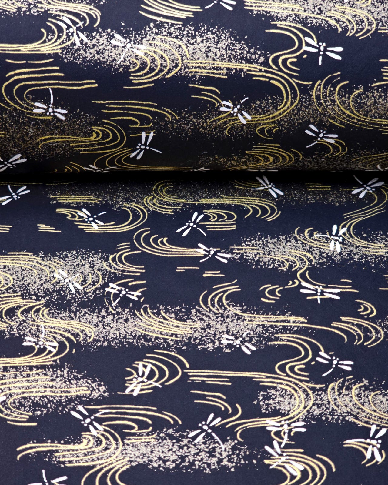 Japanese chiyogami paper featuring white dragonflies on a black background with metallic gold wavy lines.