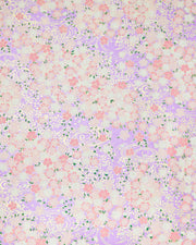 Japanese chiyogami paper featuring pink and white cherry blossoms on a pearlescent light purple background with metallic gold details.