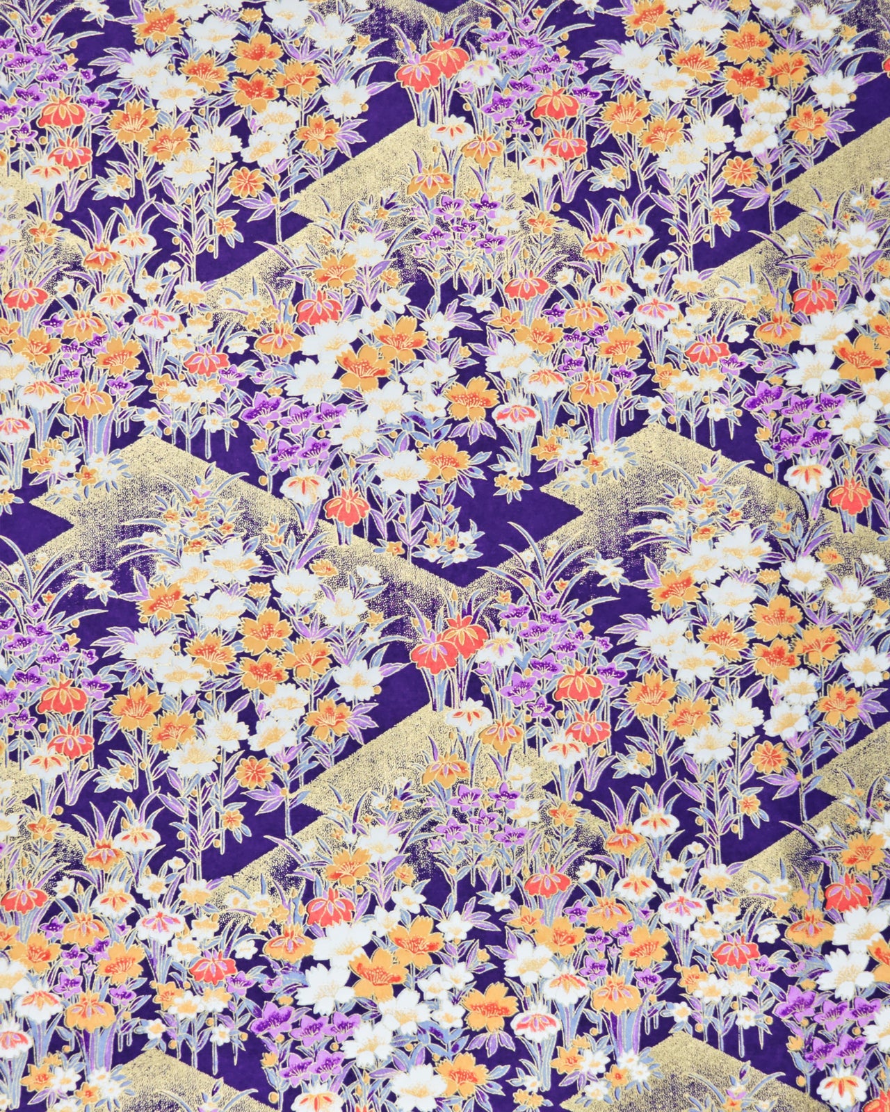 Japanese chiyogami paper featuring orange, purple, and white irises with green stems on a dark blue background with metallic gold details.