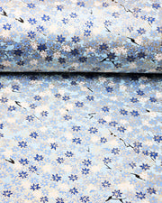 Japanese chiyogami paper featuring small blue and white momiji (maple leaves) on a light blue background with metallic gold details.