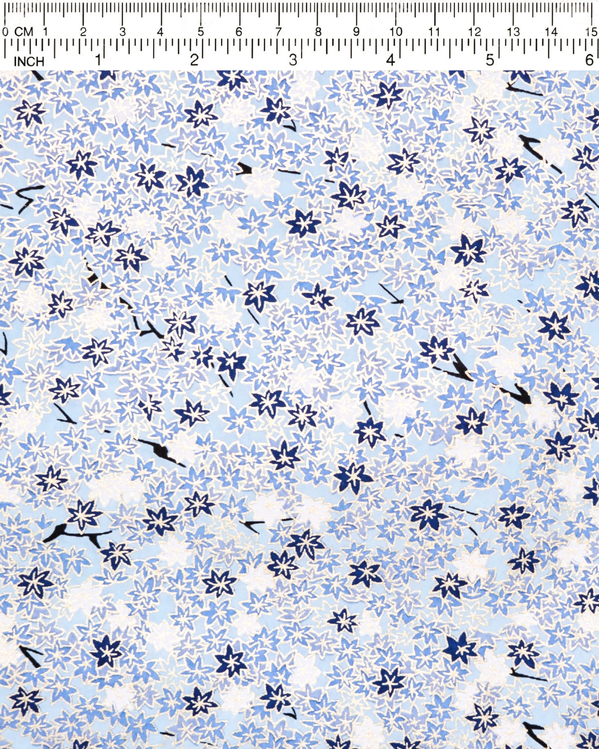 Japanese chiyogami paper featuring small blue and white momiji (maple leaves) on a light blue background with metallic gold details.